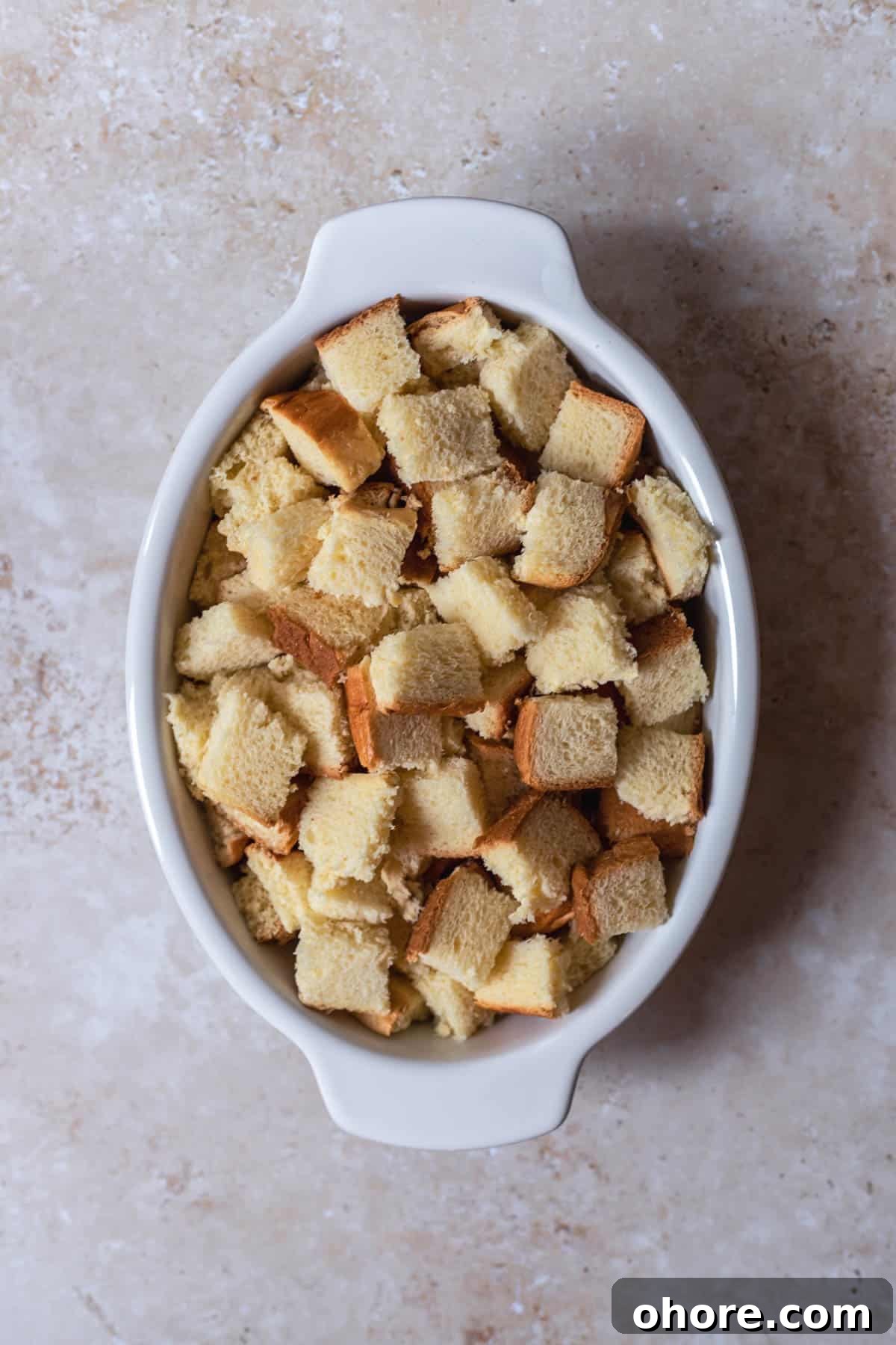Berry Brioche Cream Cheese French Toast Bake for Brunch 6 pieces of bread in an oval baking dish