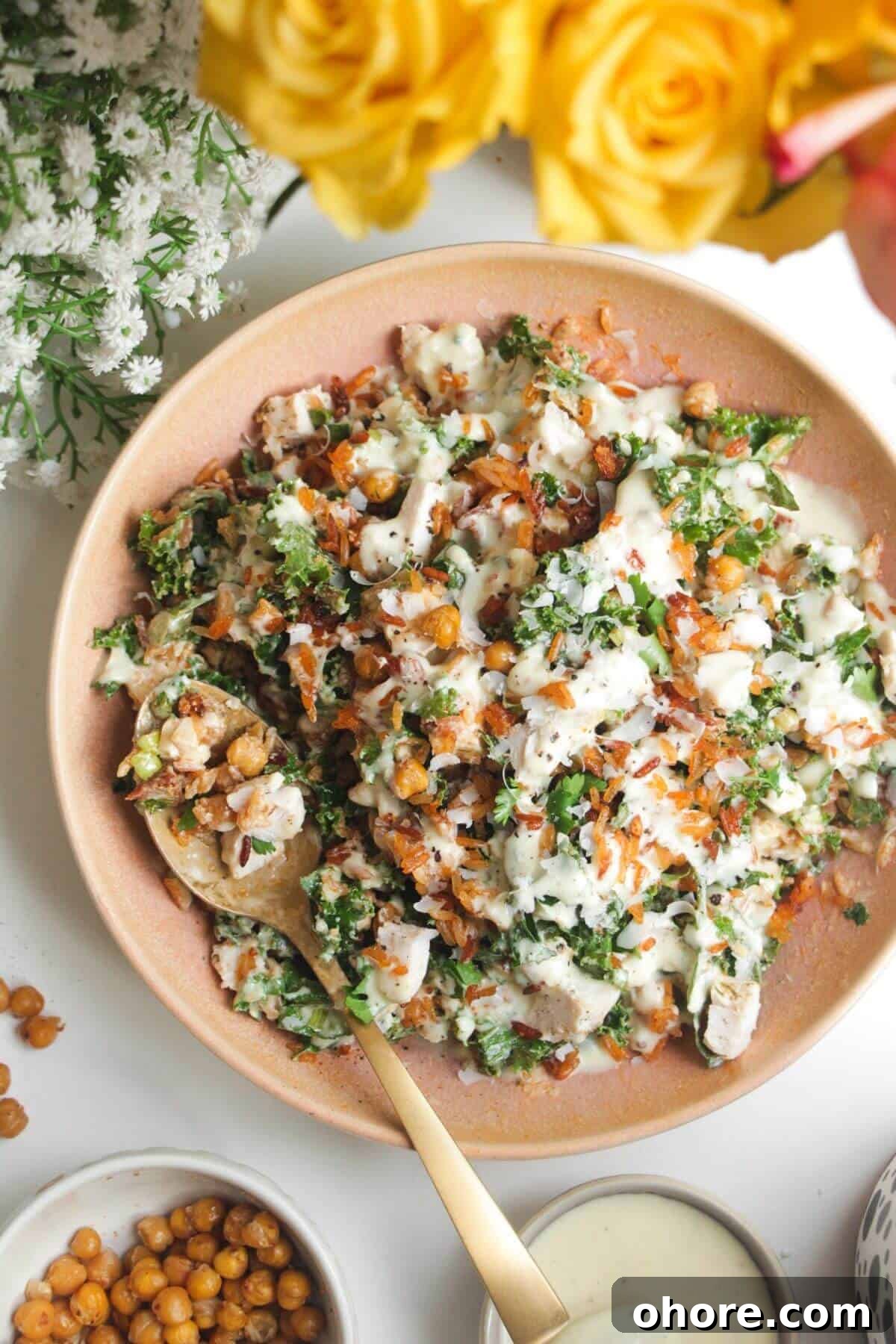 Crispy Rice Chicken Caesar Salad Recipe 2 Caesar crispy rice salad in a pink bowl.