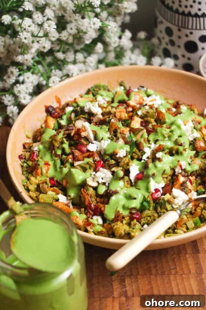 Crispy Rice Chicken Caesar Salad Recipe 15 Mediterranean crispy rice salad in a pink bowl.