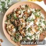 Caesar crispy rice salad in a pink bowl.