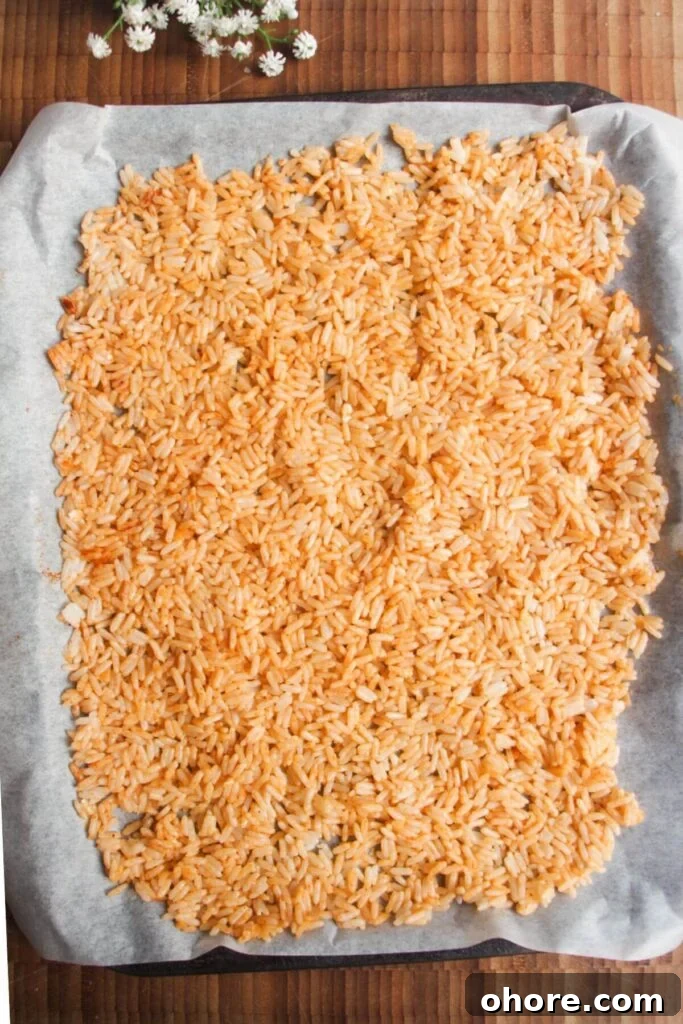 Crispy Rice Chicken Caesar Salad Recipe 5 Rice mixed with parmesan and paprika and spread on oven tray.