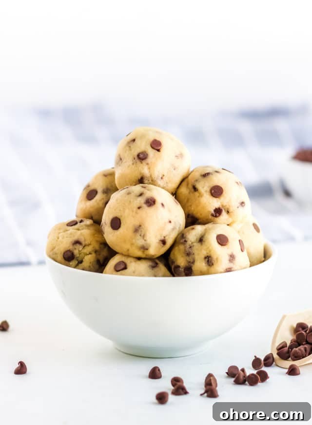 Keto Cookie Dough Fat Bombs Recipe for Low-Carb Snacking 2 cookie dough rolled into balls in a white bowl
