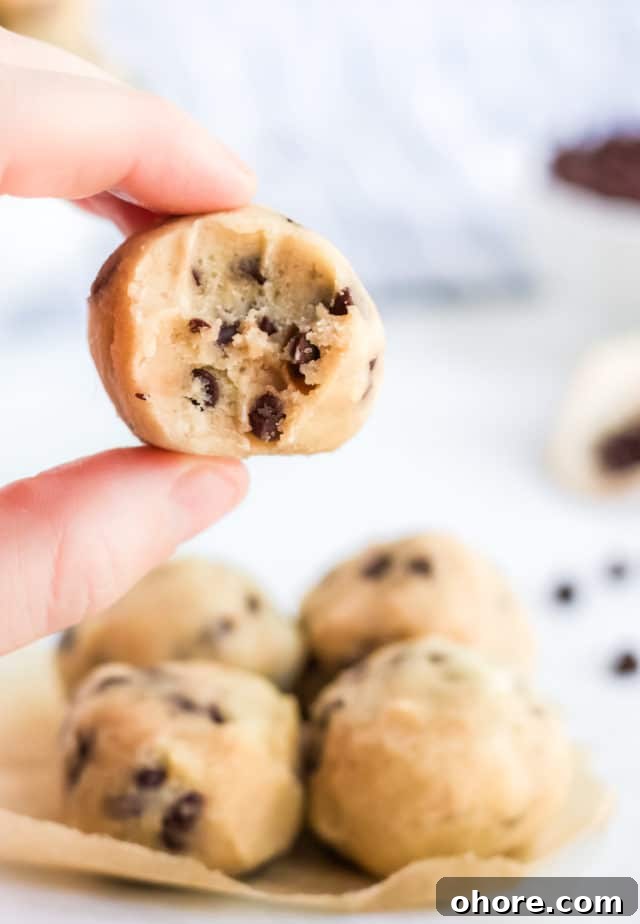 Keto Cookie Dough Fat Bombs Recipe for Low-Carb Snacking 6 a bite taken of a cookie dough ball