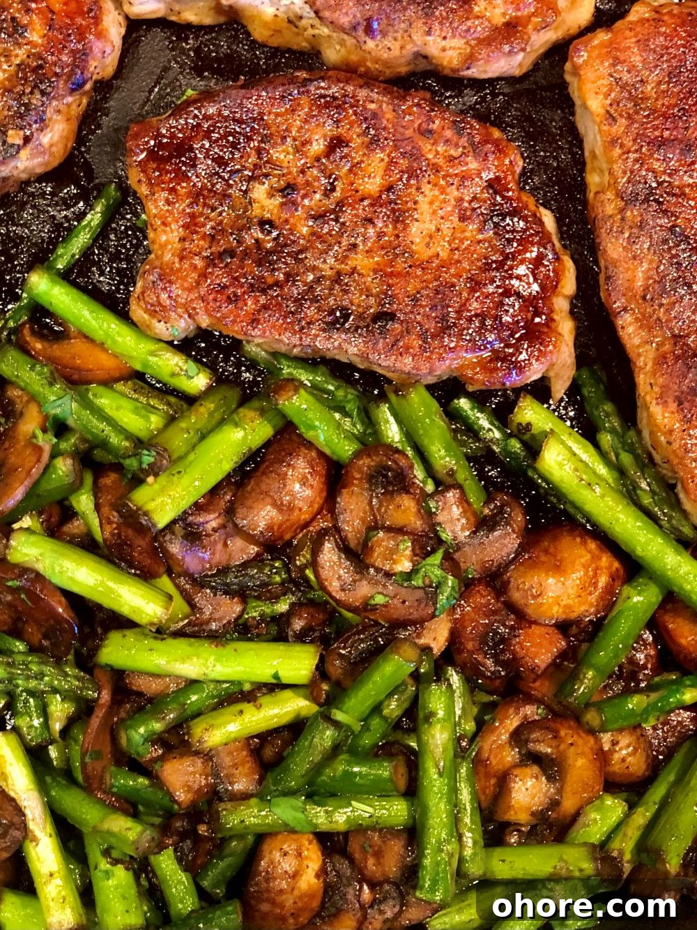 Plated pork chops and vegetables