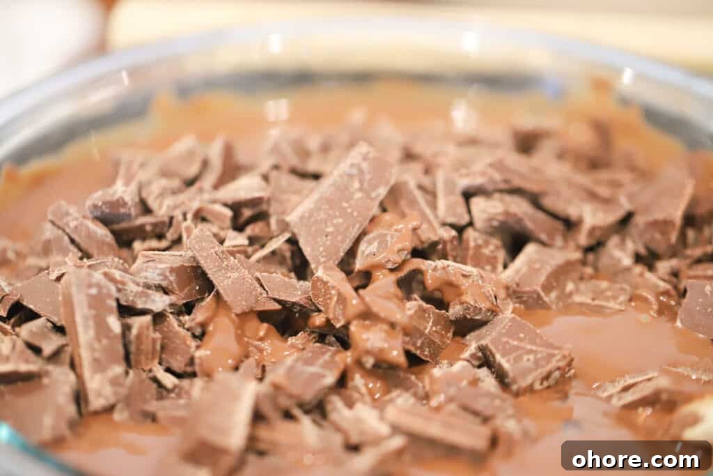 How to Choose the Perfect Chocolate Fountain for Your Event 3 Melting chocolate in a large glass bowl.