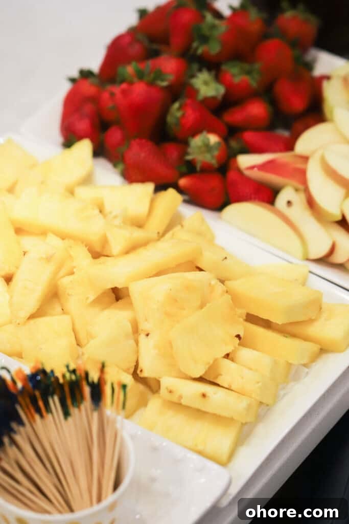 How to Choose the Perfect Chocolate Fountain for Your Event 4 Fresh fruit cut up for dipping into melted chocolate.
