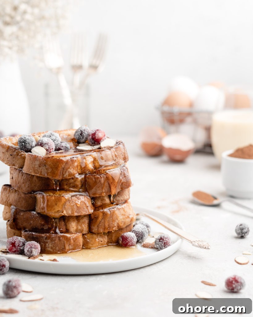 Eggnog French Toast with Buttered Maple Bourbon Syrup 2 This delicious Christmas-themed French Toast is soaked in an eggnog custard and topped with a buttered maple bourbon syrup