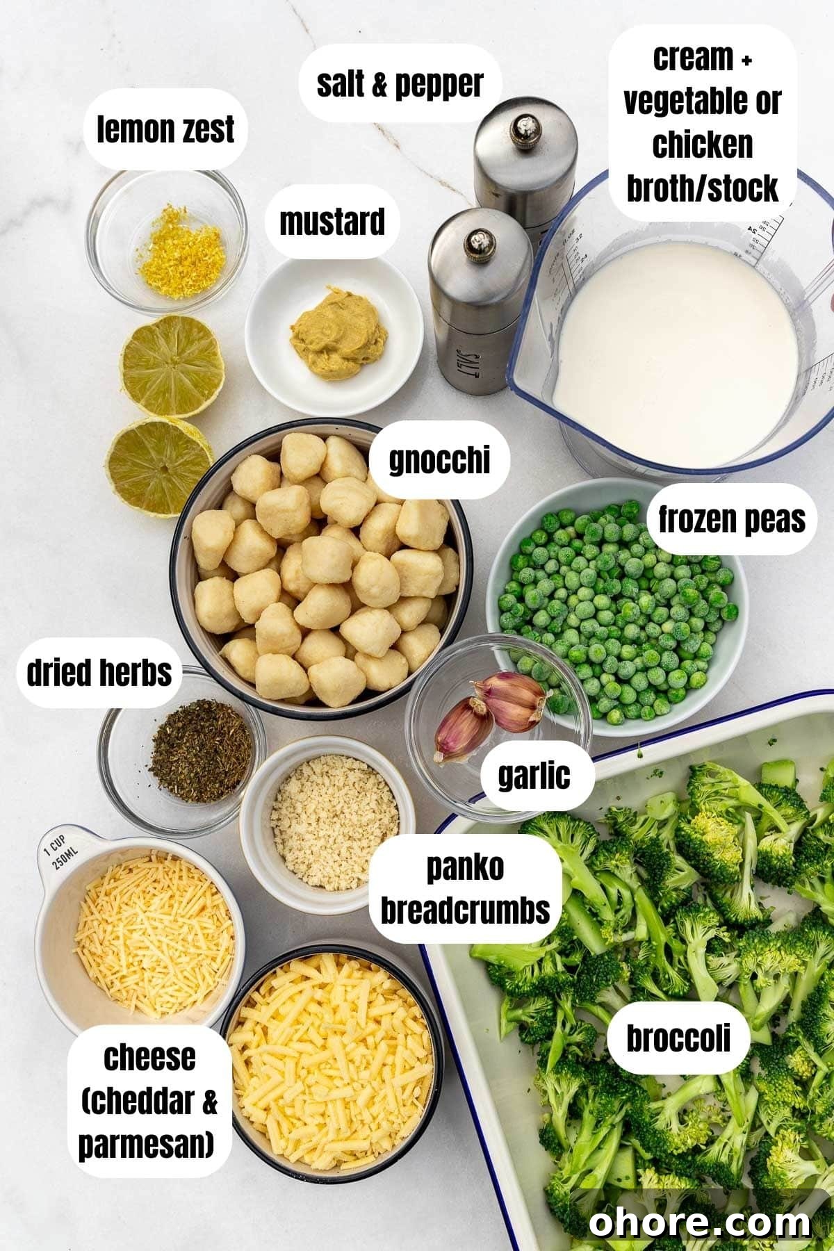 One-Pan Baked Creamy Broccoli Gnocchi Recipe 3 A collage of all the ingredients needed to make a broccoli gnocchi bake, including broccoli, cheese, mustard, cream and broth, gnocchi, salt and pepper, lemon zest, dried herbs, frozen peas and garlic, labelled.