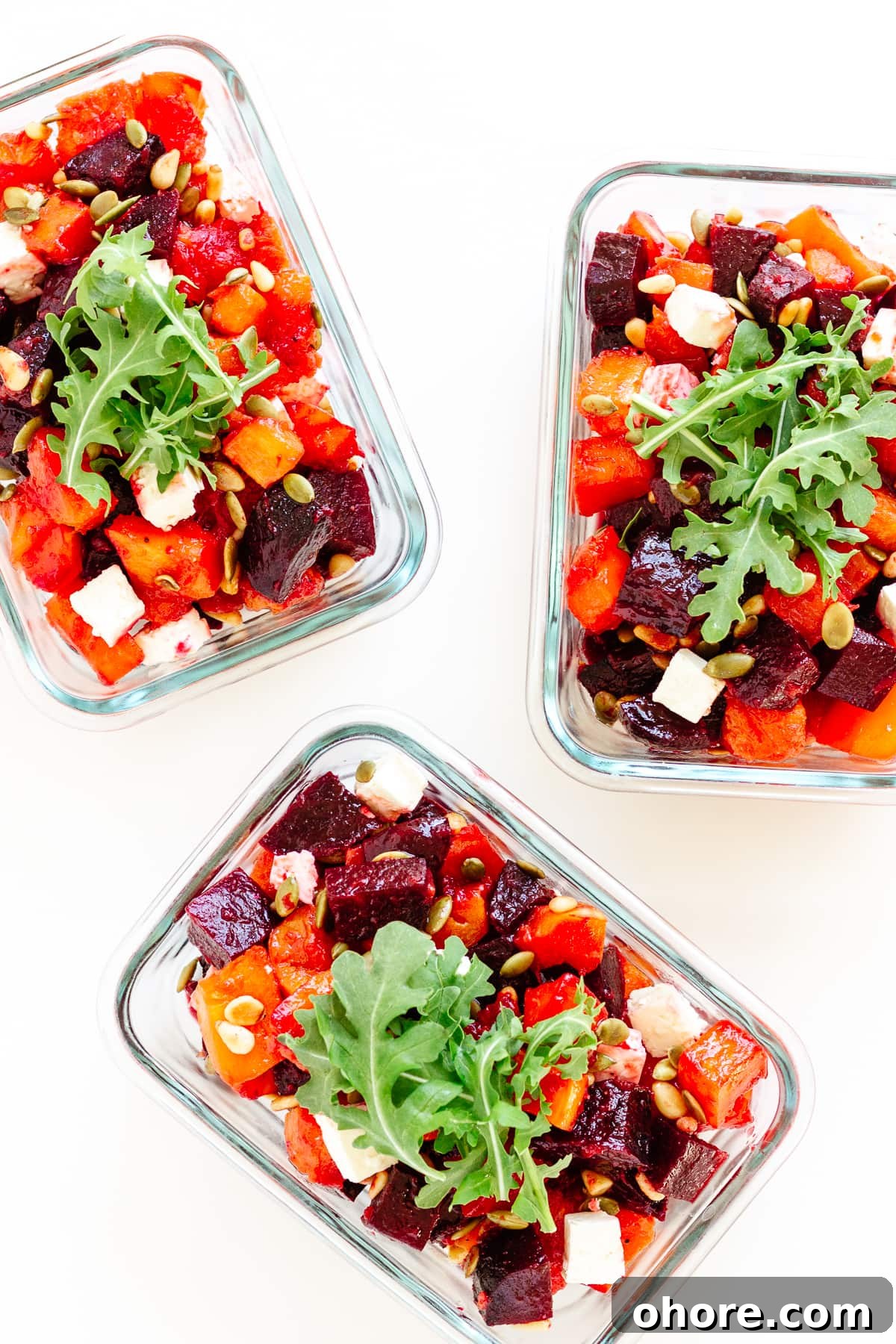 Roasted Pumpkin and Beetroot Salad with Feta and Toasted Seeds 12 Three glass meal prep containers containing roasted pumpkin, beetroot and feta salad.