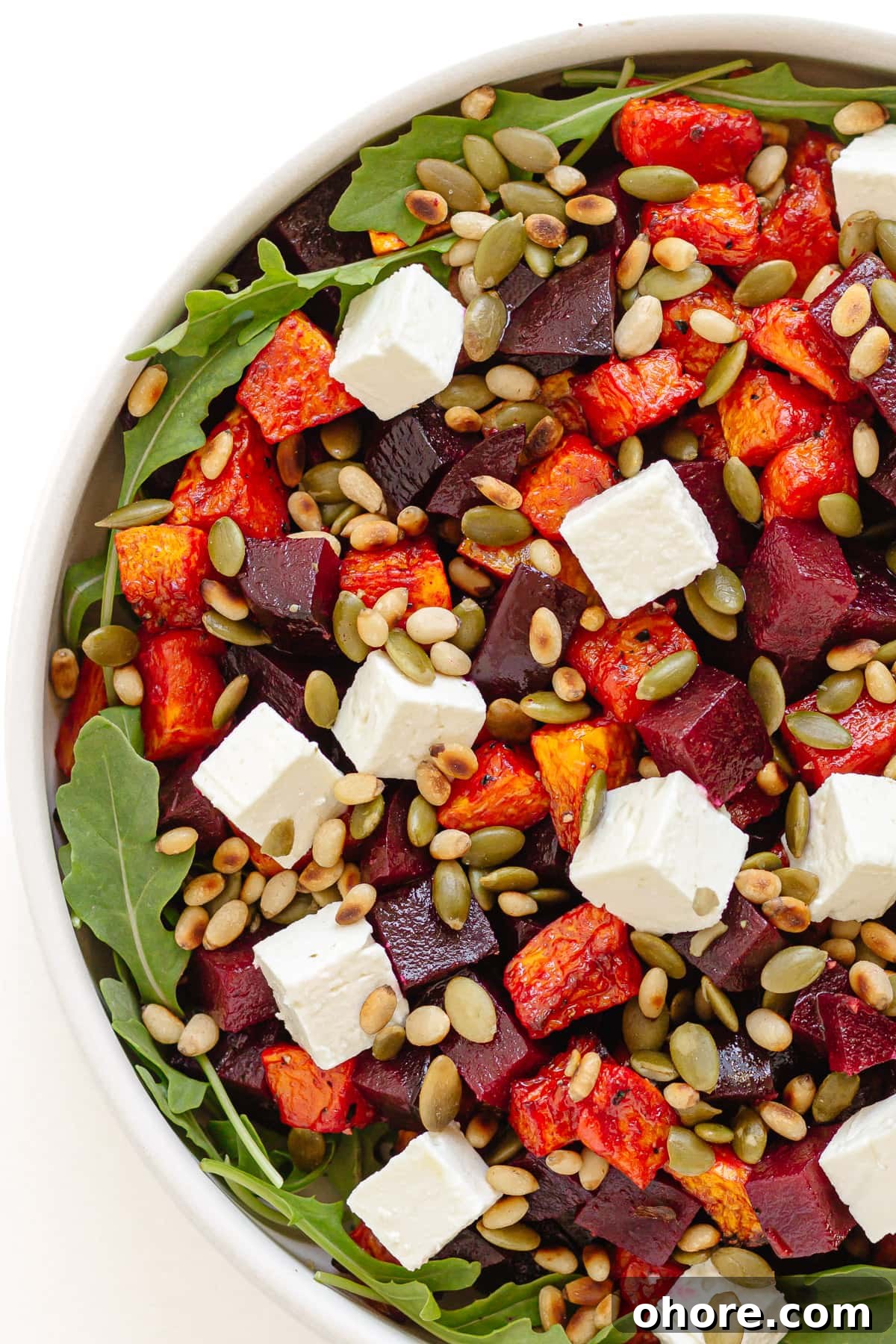 Roasted Pumpkin and Beetroot Salad with Feta and Toasted Seeds 3 Roast pumpkin and beet salad in a serving bowl.
