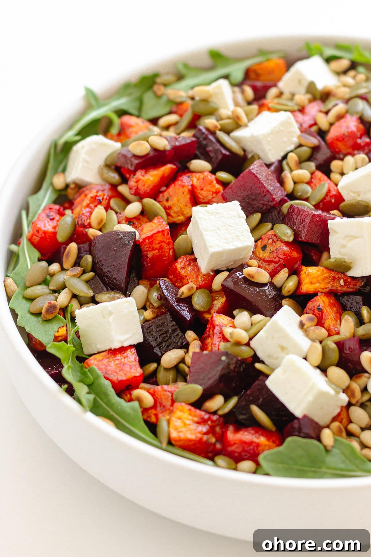 Roasted Pumpkin and Beetroot Salad with Feta and Toasted Seeds 9 Serving bowl of pumpkin and beetroot salad.