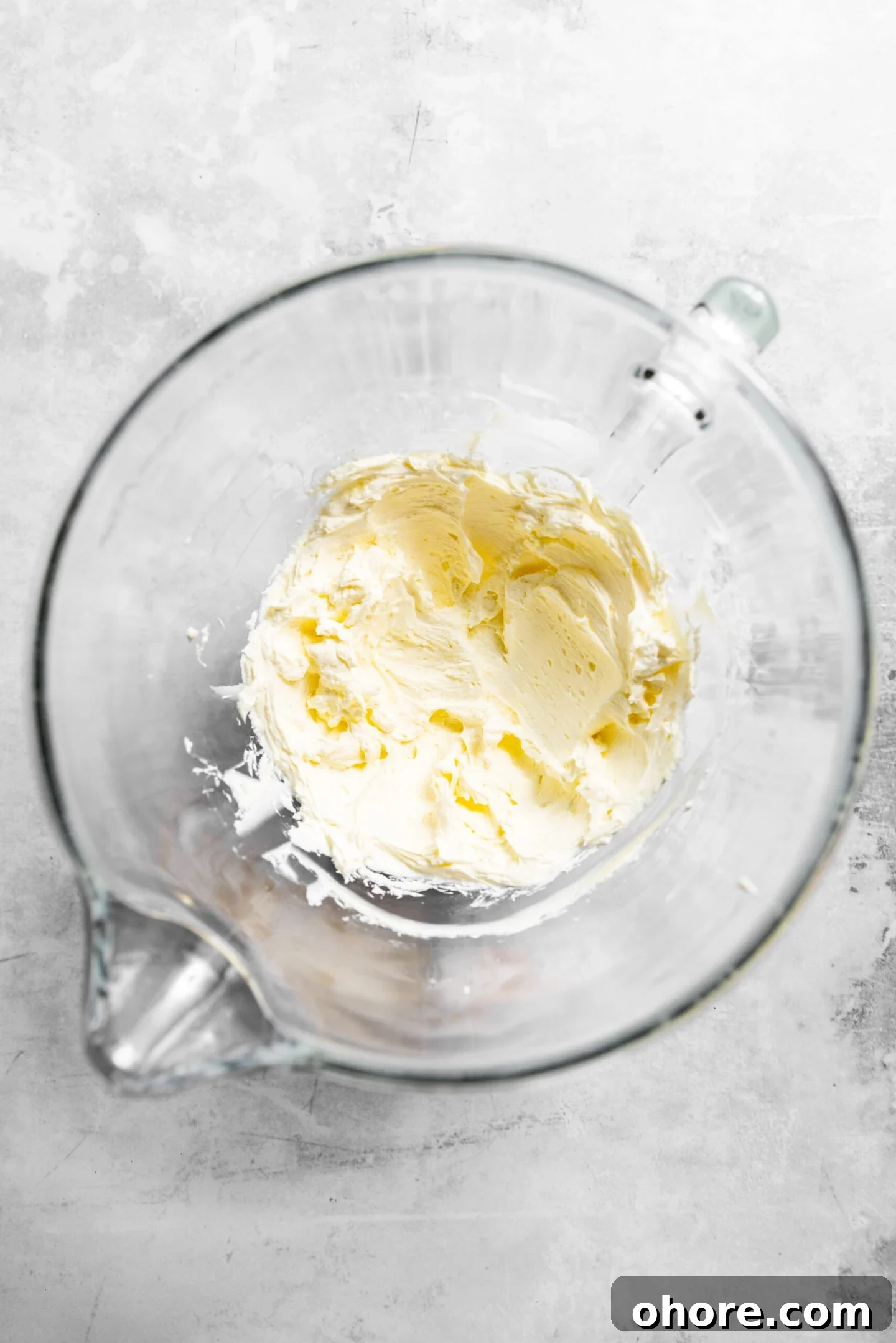 Cream Cheese Frosting with 5 Simple Ingredients 3 Butter and cream cheese whipped together in a clear bowl.