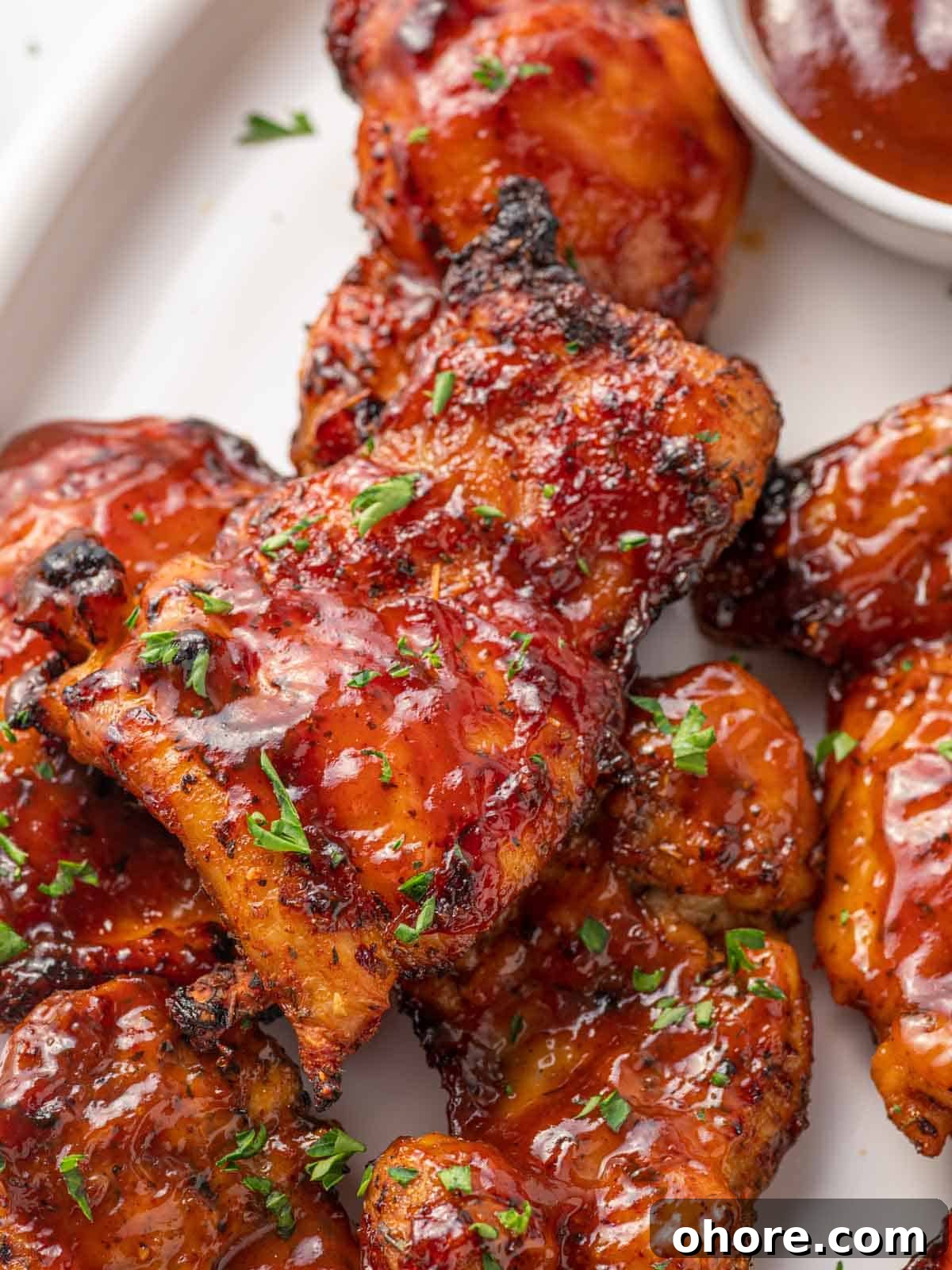 Crispy Air Fryer BBQ Chicken Recipe for Juicy, Quick Dinners 7 Closeup of air fryer barbecue chicken thighs.