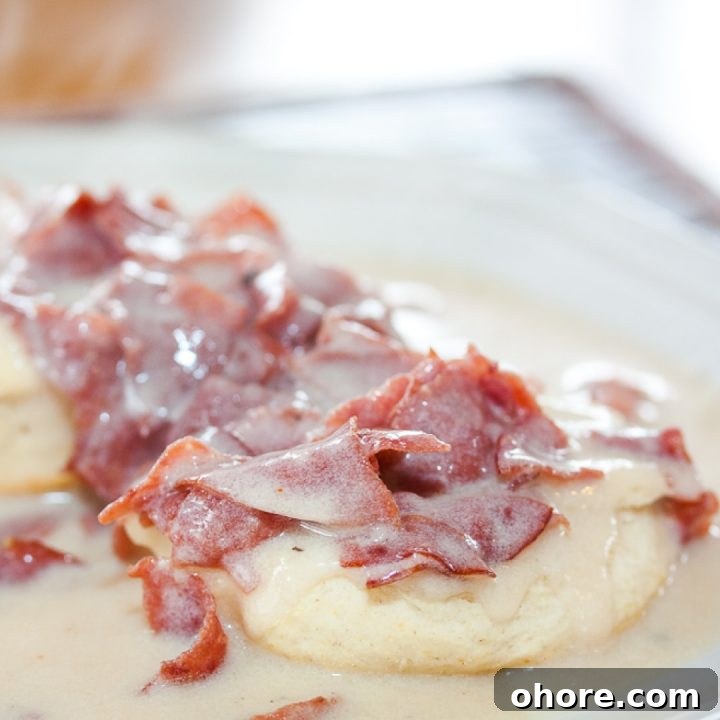 Week 34 Meal Plan for Group 2: Weekly Menu & Grocery List 3 Chipped Beef Gravy and Biscuits on a white plate