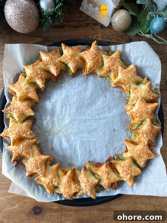 Pesto Puff Pastry Star Wreath Recipe for Holiday Appetizers 10 Wreath fresh out of the oven, looking golden brown and Delicious.