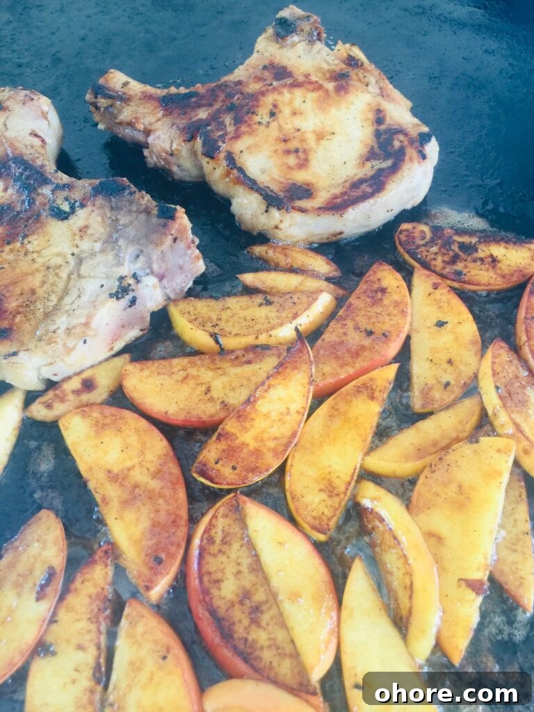 Apple-Brined Pork Chops on the Blackstone Grill 7 pork and apples halfway through cooking