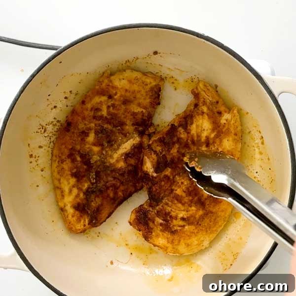 Stovetop Dutch Oven Shredded Chicken Recipe 6 Browning chicken breasts in pot.
