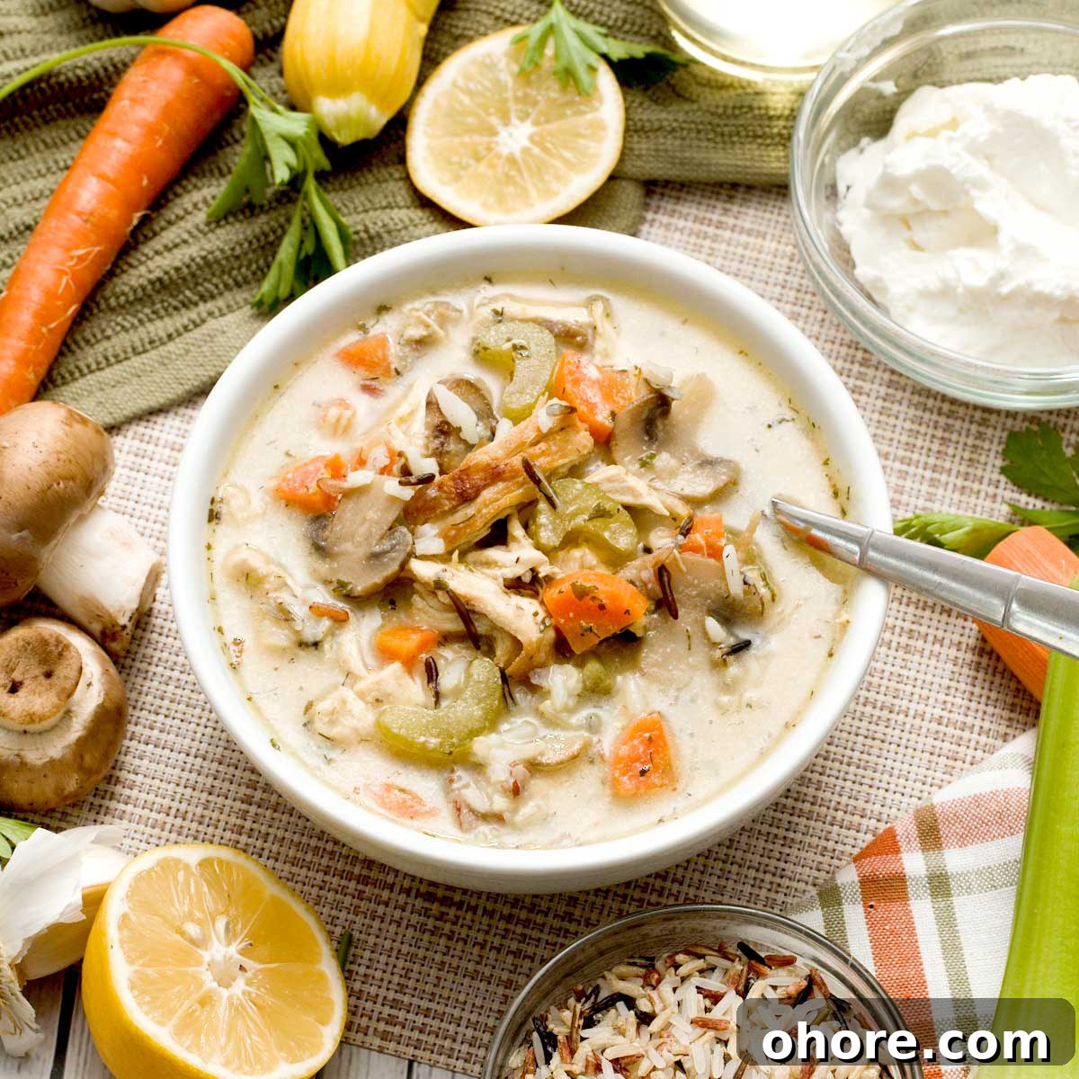 Stovetop Dutch Oven Shredded Chicken Recipe 9 A bowl of creamy chicken and wild rice soup without cream and with greek yogurt.