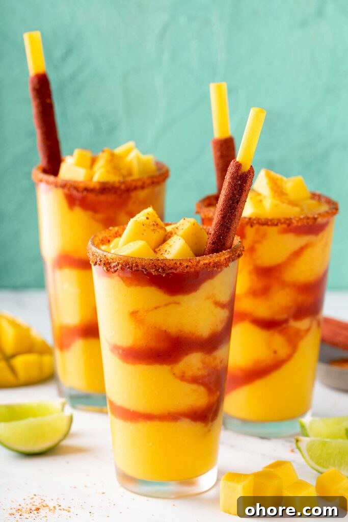 mangonada recipe with chamoy and tajin served in tall glasses