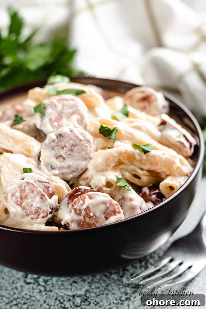 Creamy Kielbasa Pasta Recipe with Garlic Parmesan Sauce 2 The finished pasta dish in a earthen ware bowl.