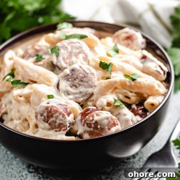 Creamy Kielbasa Pasta Recipe with Garlic Parmesan Sauce 8 The kielbasa pasta topped with fresh parsley.