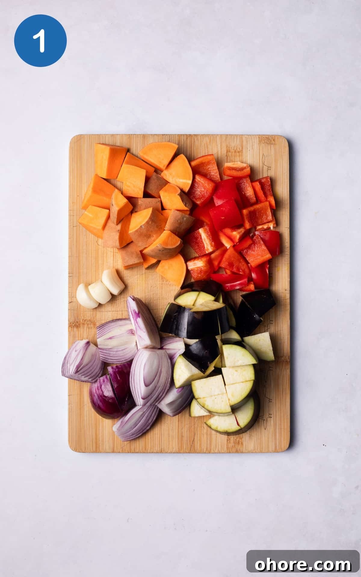 Chopped vegetables on a wooden cutting board.