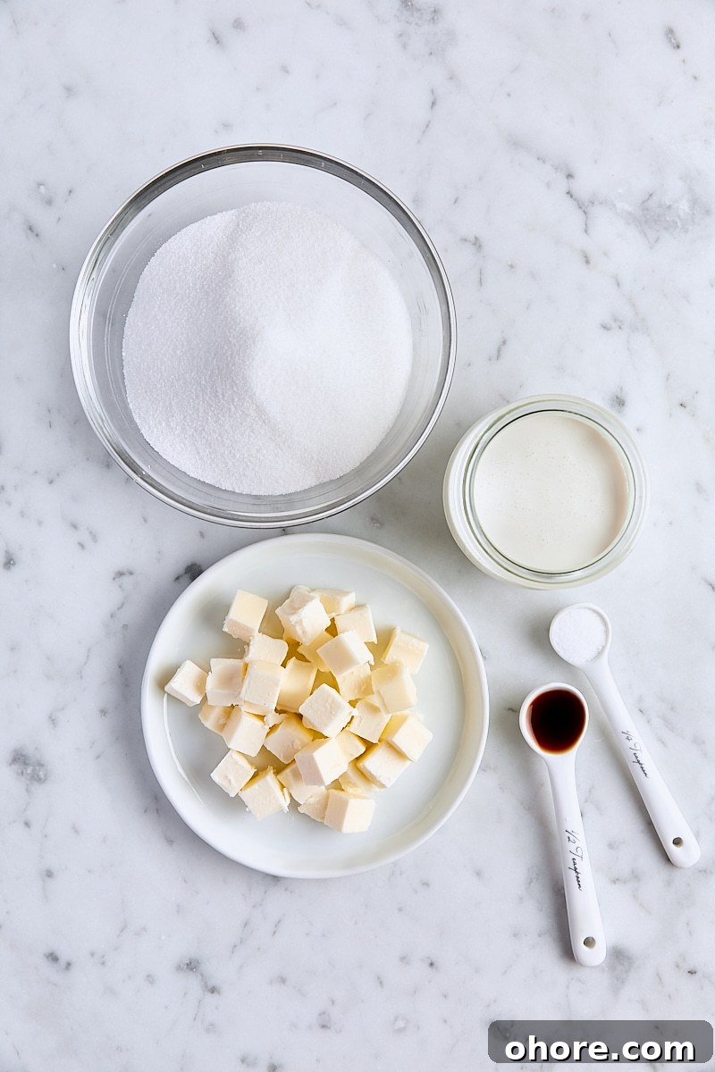 Ingredients for caramel sauce on white marble background