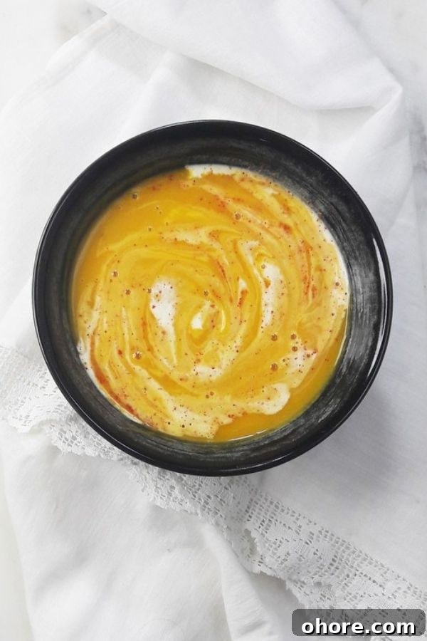 French pumpkin soup with a white lace background