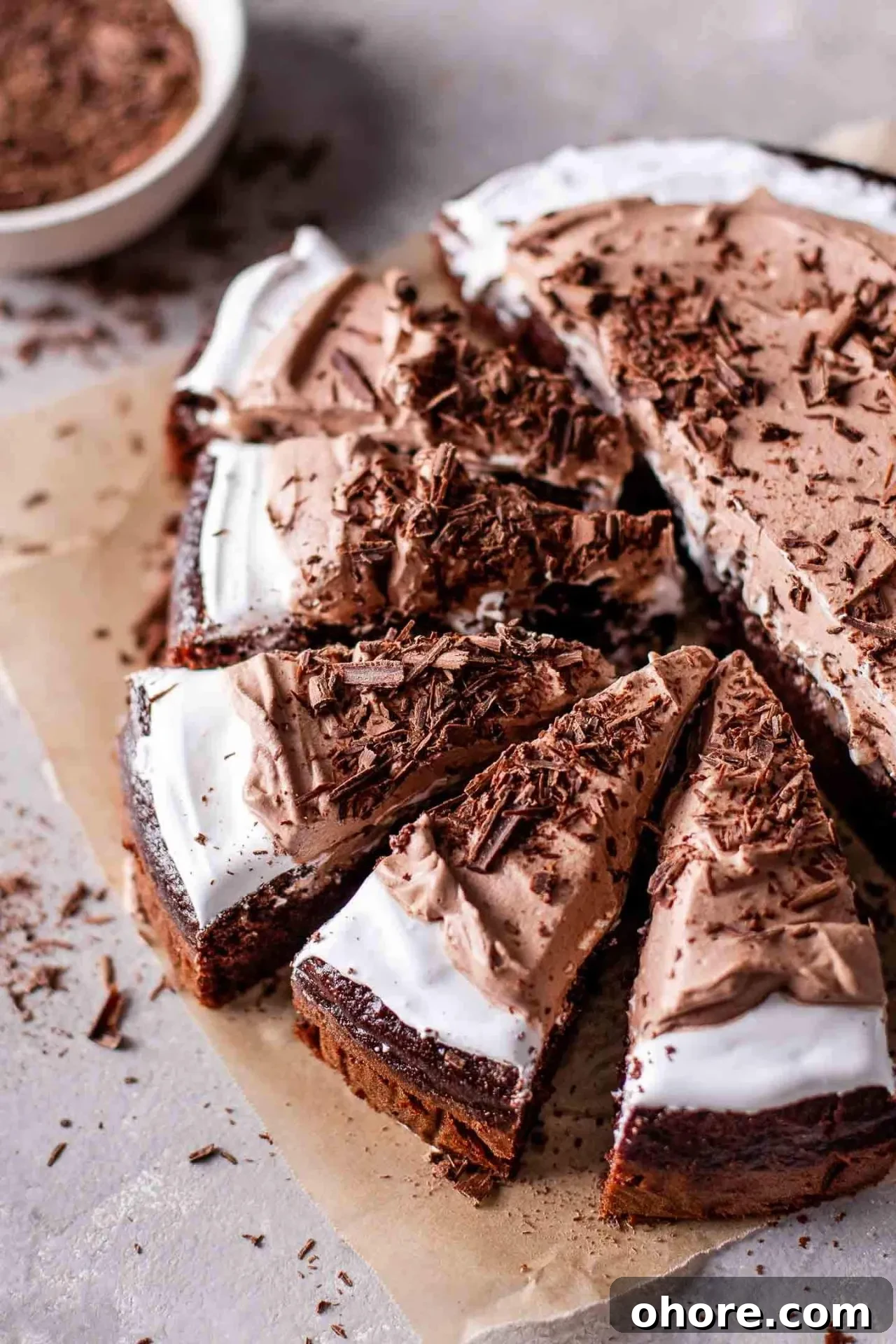Decadent Hot Chocolate Poke Cake Recipe for Chocolate Lovers 11 sliced hot chocolate poke cake on parchment paper (2)