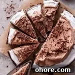 sliced hot chocolate poke cake on parchment paper (1)