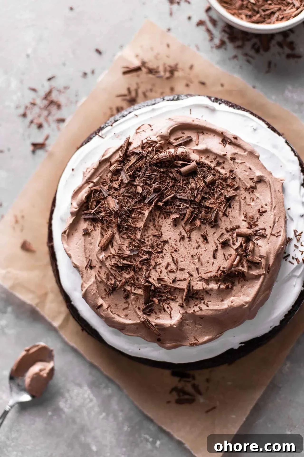 Decadent Hot Chocolate Poke Cake Recipe for Chocolate Lovers 3 decorated hot chocolate poke cake on parchment paper (2)