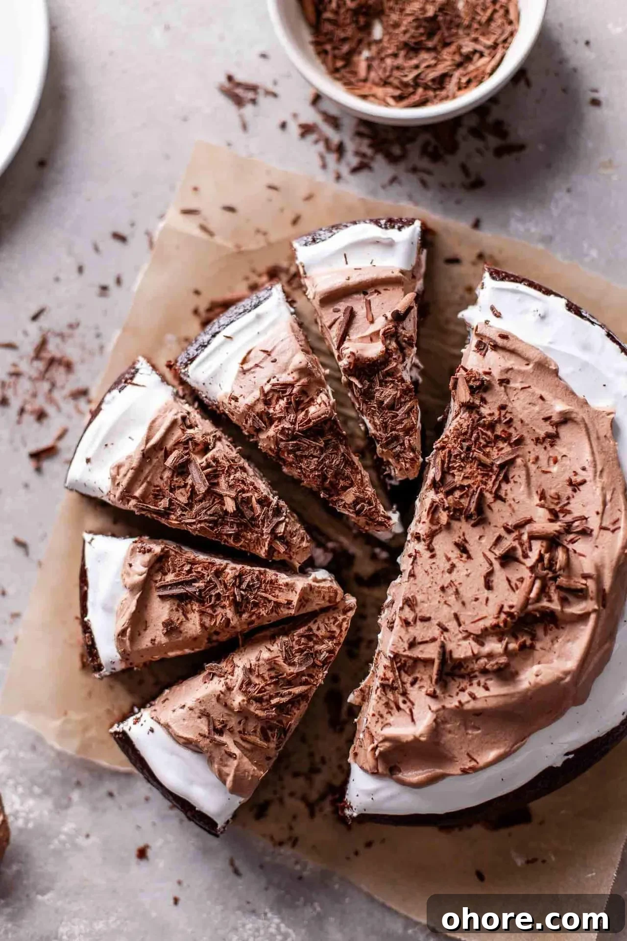 Decadent Hot Chocolate Poke Cake Recipe for Chocolate Lovers 4 sliced hot chocolate poke cake on parchment paper (3)
