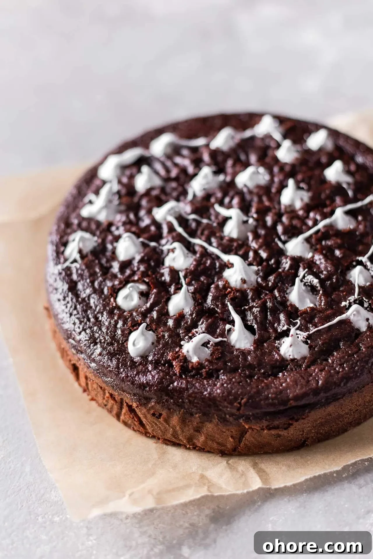 Decadent Hot Chocolate Poke Cake Recipe for Chocolate Lovers 10 hot chocolate poke cake holes filled with marshmallow creme