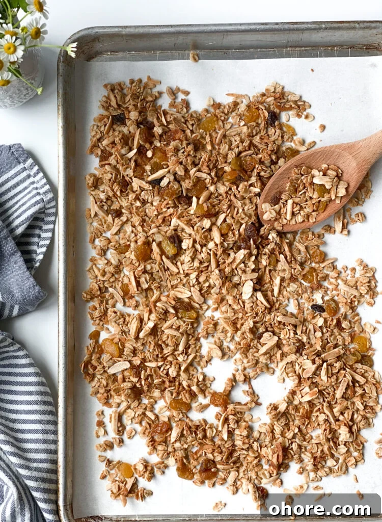 Almond Coconut Granola Recipe with Crunchy Clusters 2 Almond coconut granola on a baking sheet