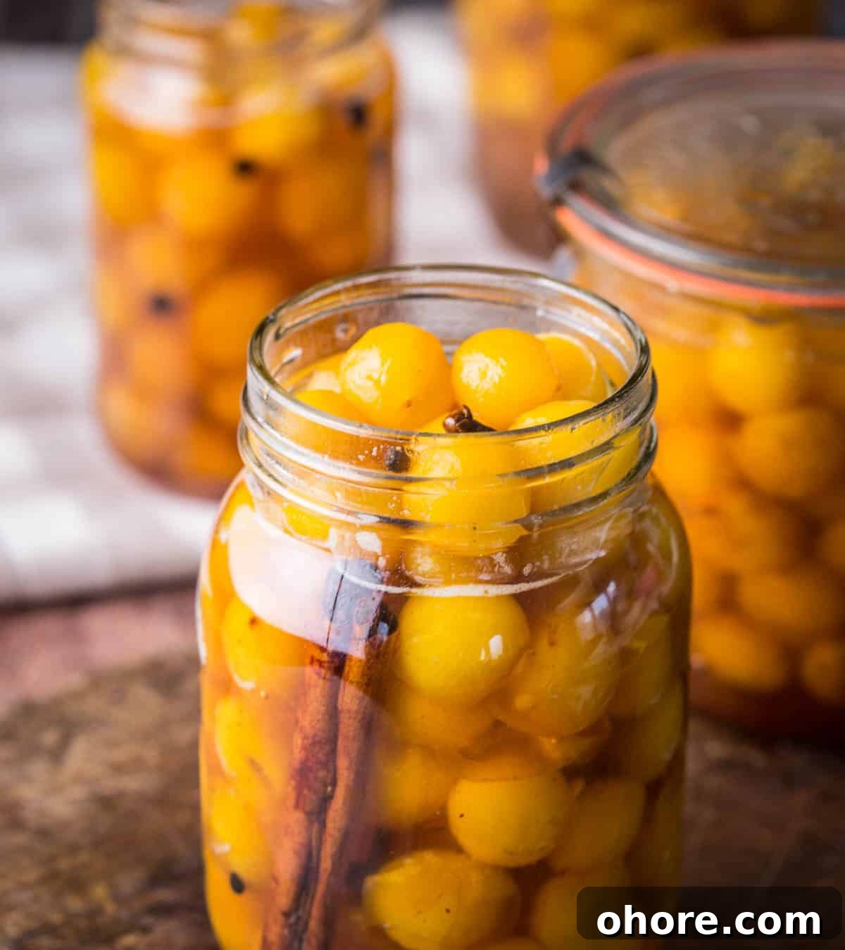 Pickled mirabelles packed into a sterilised jar.