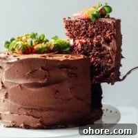 Decadent Chocolate Strawberry Layer Cake Recipe 4 a bowl of brown liquid.
