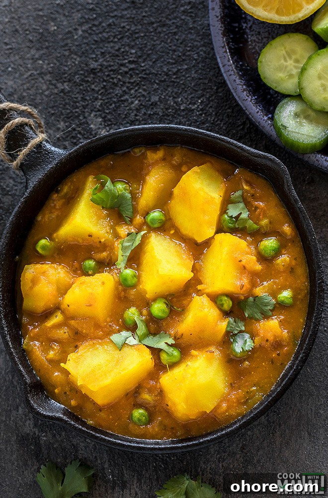 Instant Pot Aloo Matar (Potatoes and Peas Curry) 7 instant pot aloo matar served in a small black skillet