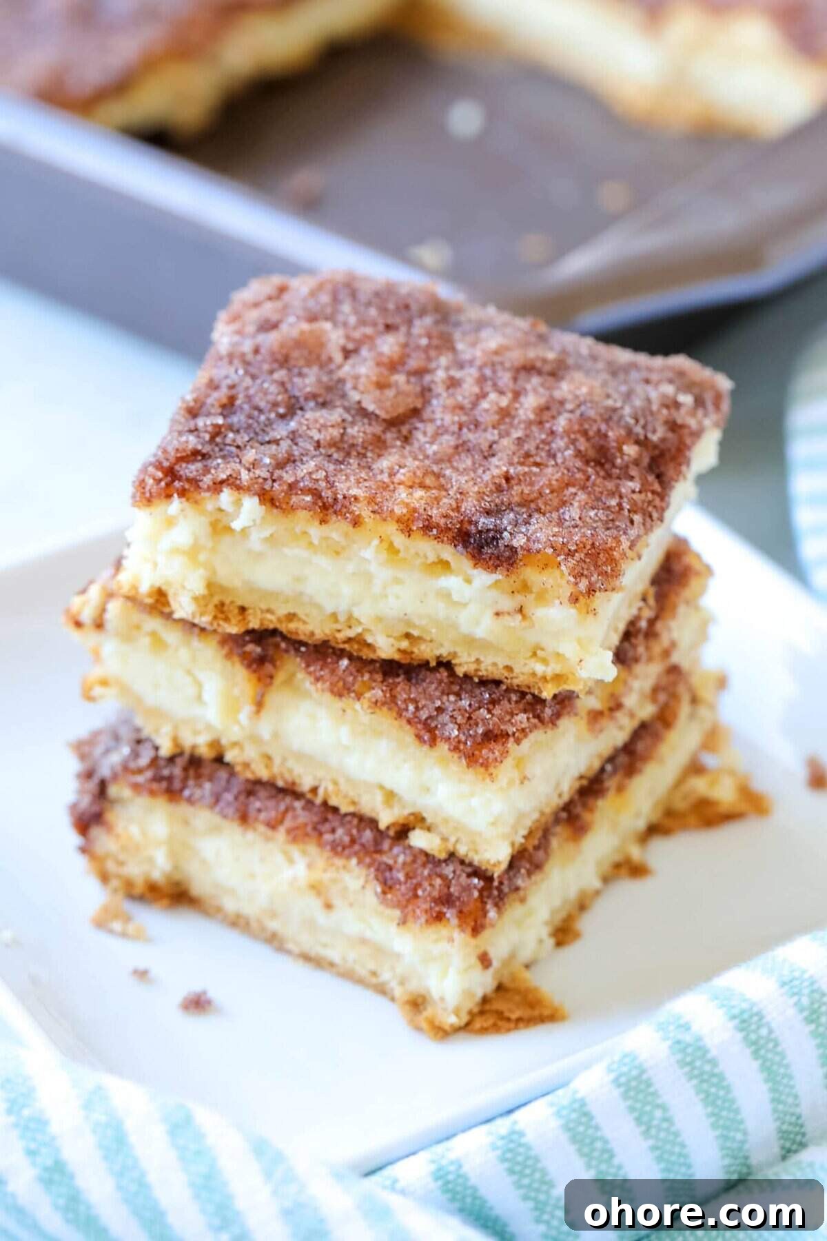 Sopapilla Cheesecake bar recipe sopapilla cheesecake bars stacked on top of one another