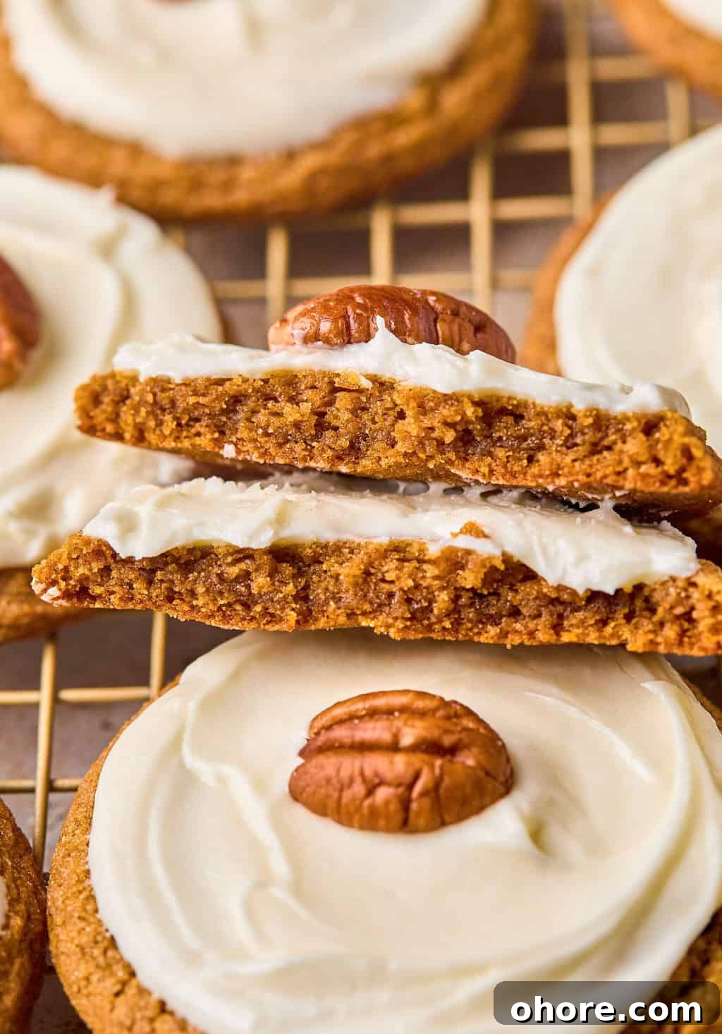 Pumpkin Spice Molasses Cookies Recipe for Cozy Fall Baking 16 Pumpkin cookies broken in half and stacked.
