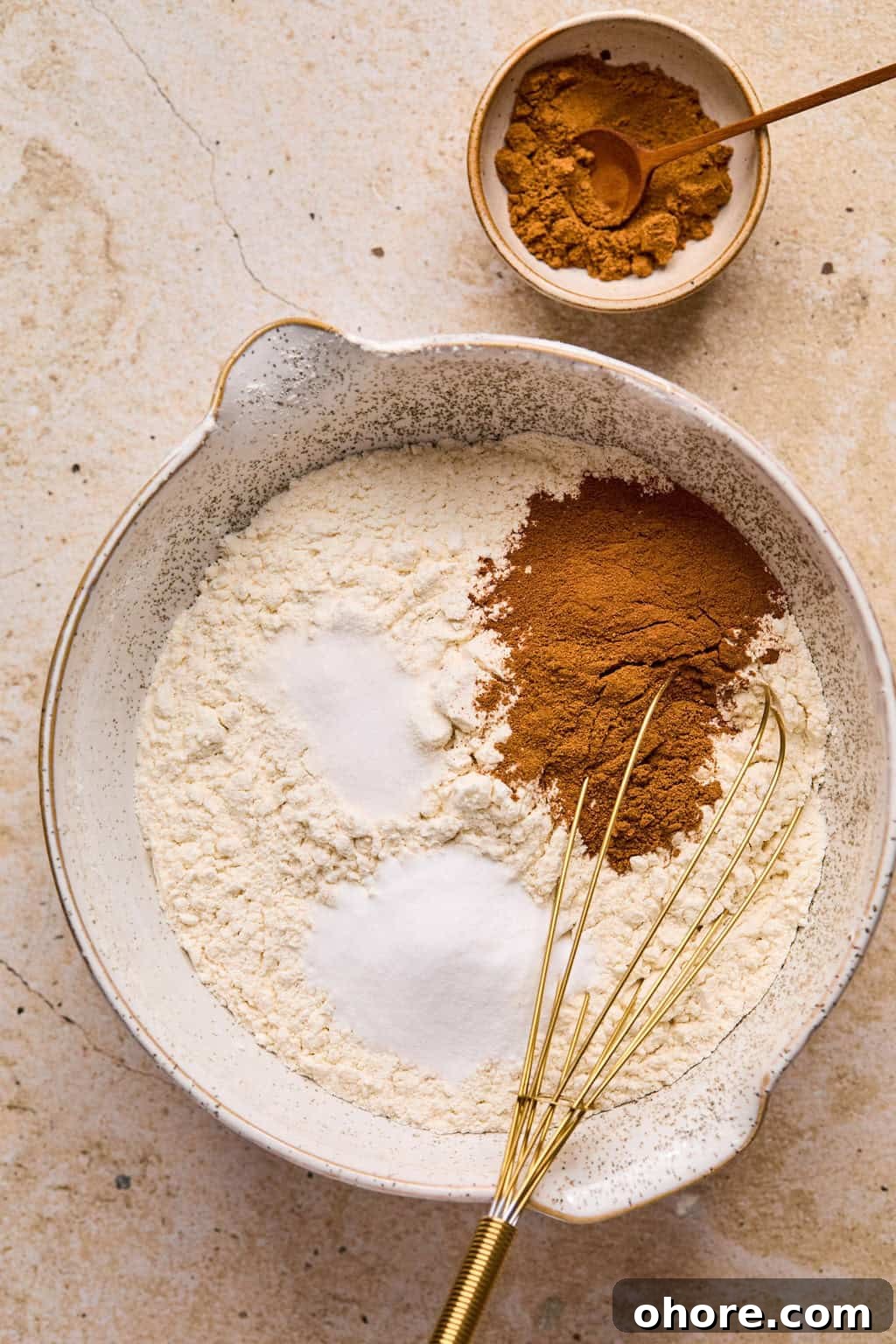 Pumpkin Spice Molasses Cookies Recipe for Cozy Fall Baking 6 Dry ingredients for cookies in mixing bowl with whisk.