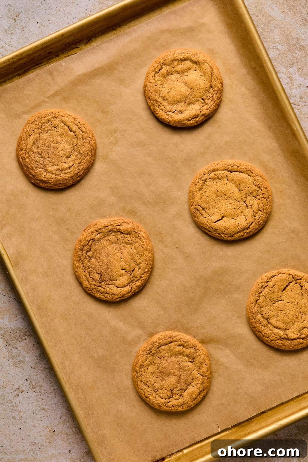 Pumpkin Spice Molasses Cookies Recipe for Cozy Fall Baking 10 Baked pumpkin molasses cookies on baking sheet.