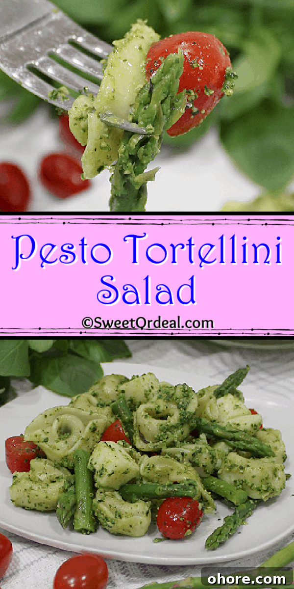 Fork holding asparagus spear, a tortellini, and half a cherry tomato.