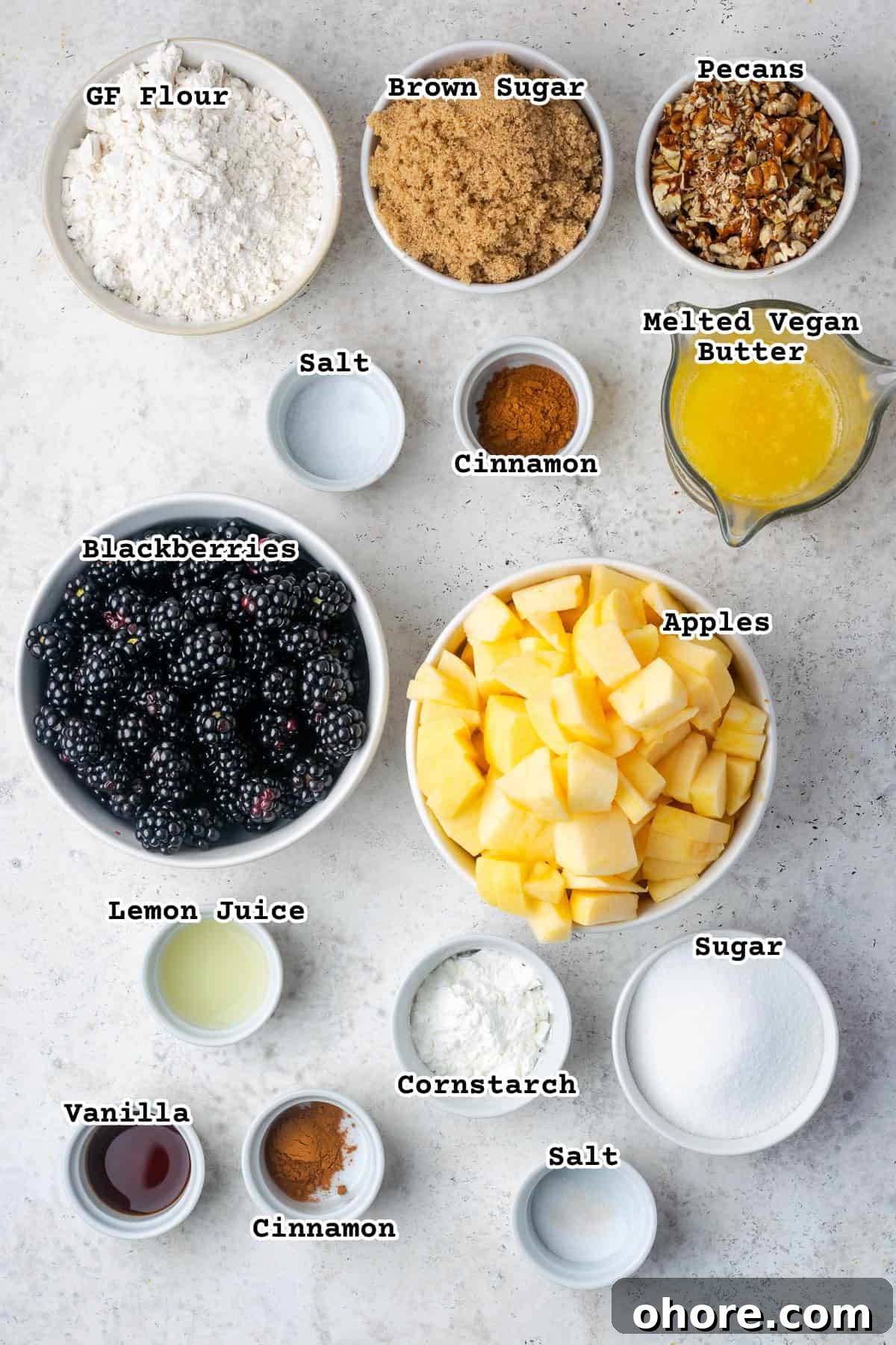 Apple & Blackberry Crumble Recipe: Rustic Autumn Dessert 3 Ingredients for an apple and blackberry crumble sitting on a white counter.