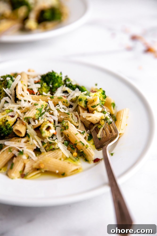 Broccoli Pasta Kids Will Actually Love: Creamy Weeknight Recipe 2 Broccoli pasta on plates with fork
