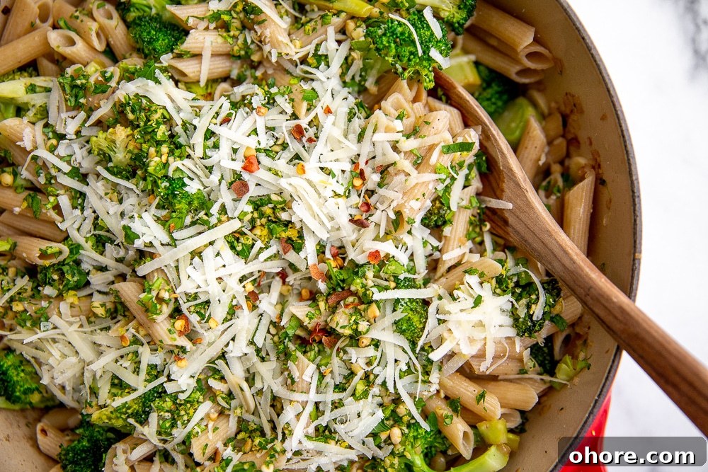 Broccoli Pasta Kids Will Actually Love: Creamy Weeknight Recipe 4 Broccoli pasta in skillet with wooden spoon