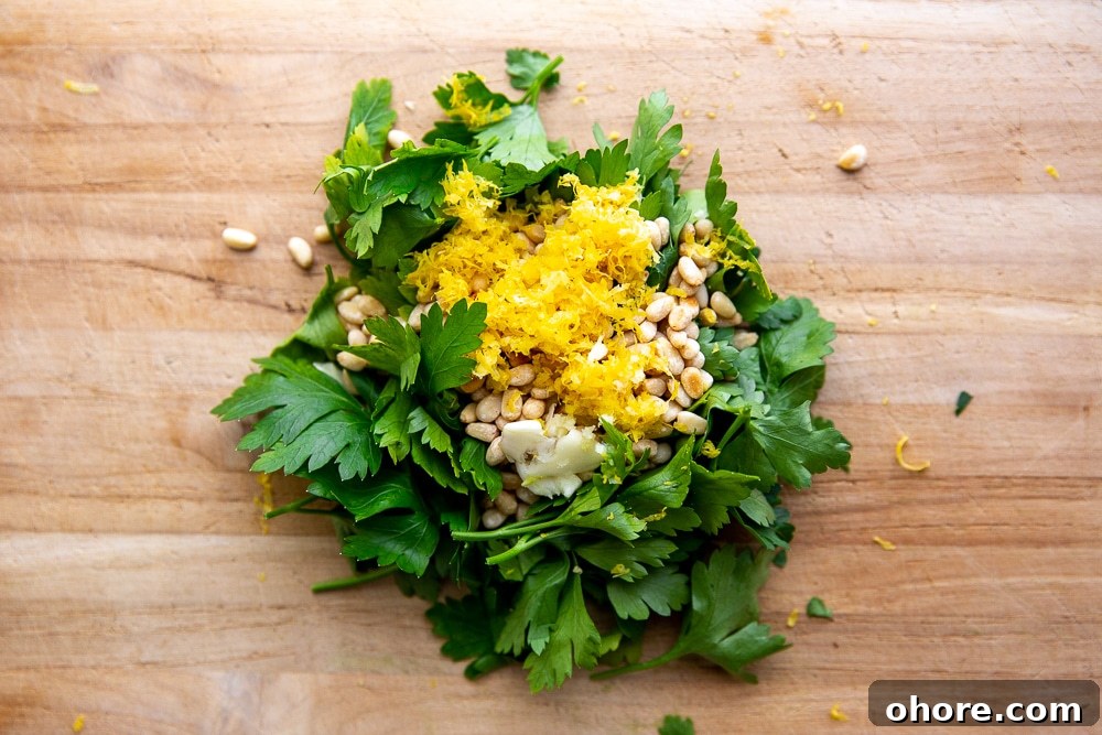 Broccoli Pasta Kids Will Actually Love: Creamy Weeknight Recipe 6 Parsley, pine nuts, lemon zest and garlic piled on cutting board for the gremolata, to sprinkle over the broccoli pasta