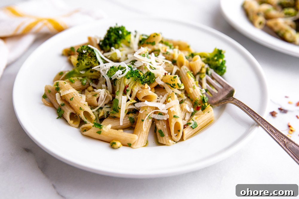 Broccoli Pasta Kids Will Actually Love: Creamy Weeknight Recipe 9 Broccoli pasta on plates with fork and napkin in the background