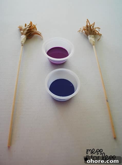 Creative Rubber Band Paintbrush Techniques for Stunning Art 5 painting with rubber band paintbrushes with cups of paint