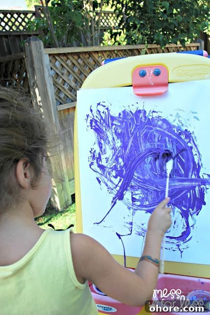 Creative Rubber Band Paintbrush Techniques for Stunning Art 7 painting with rubber band paintbrushes on an easel