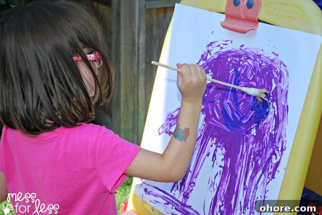 Creative Rubber Band Paintbrush Techniques for Stunning Art 9 child painting with rubber band paintbrushes